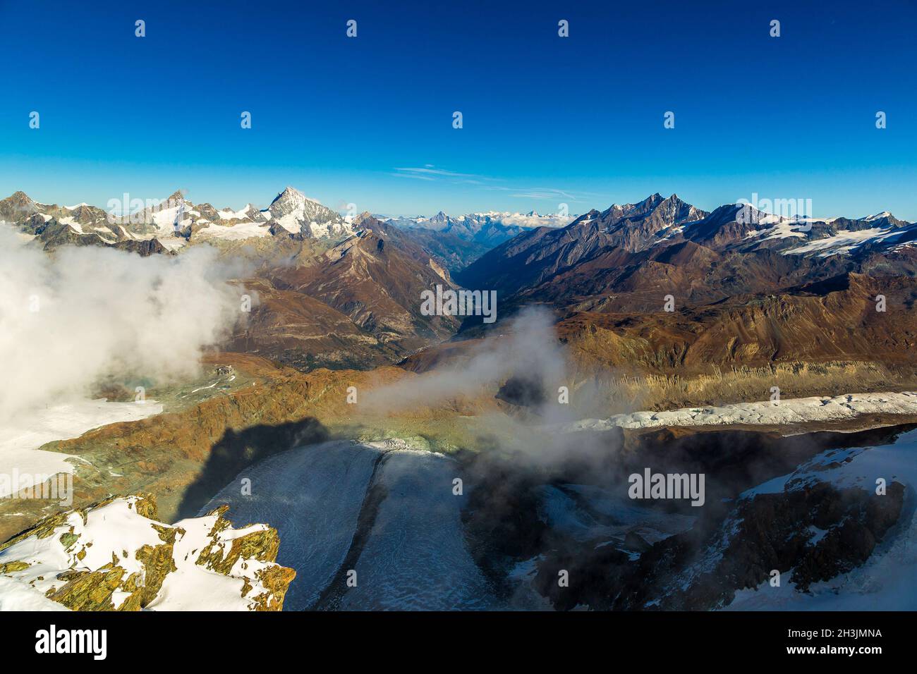 Swiss alps mountain snow aerial valley hi-res stock photography and ...