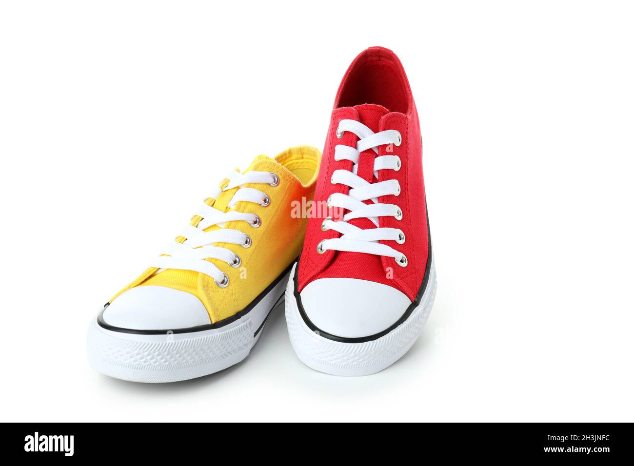 Pair of red and yellow sneakers isolated on white background Stock ...