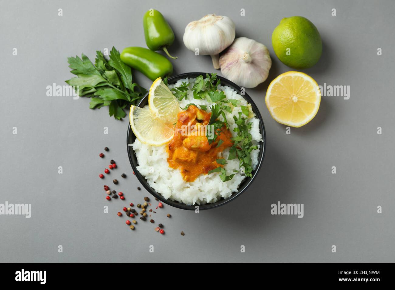 Chicken tikka with ingredients on gray background Stock Photo Alamy