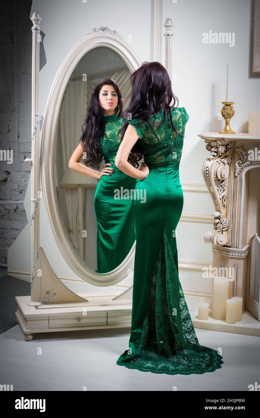 Woman in green evening dress Stock Photo