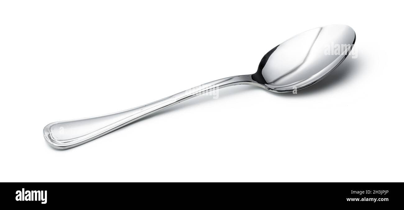 Silver shiny spoon isolated on white background Stock Photo - Alamy
