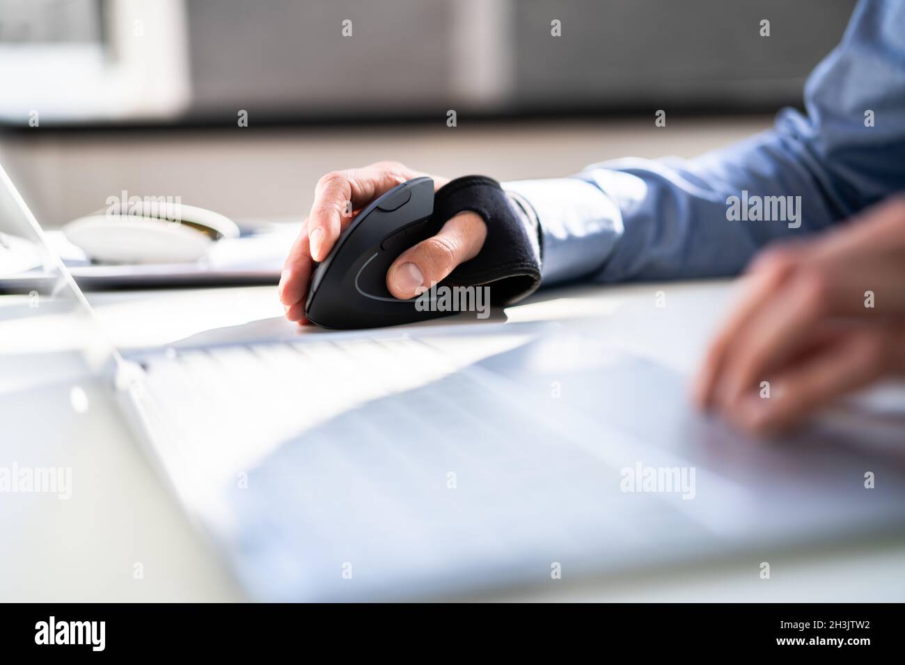 Vertical Ergonomic Optical Mouse For Carpal Tunnel Syndrome Prevention  Stock Photo - Alamy