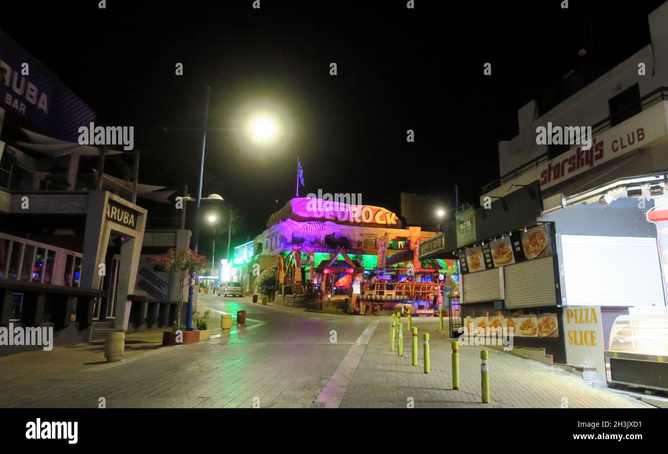 Ayia Napa, Cyprus - 14 October, 2021: Street of nightclubs and bars in the city center Stock Photo