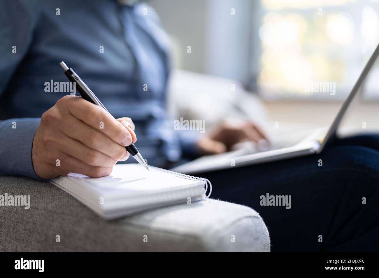 Someone Writing Or Planning. Journalist Working On Laptop Stock Photo