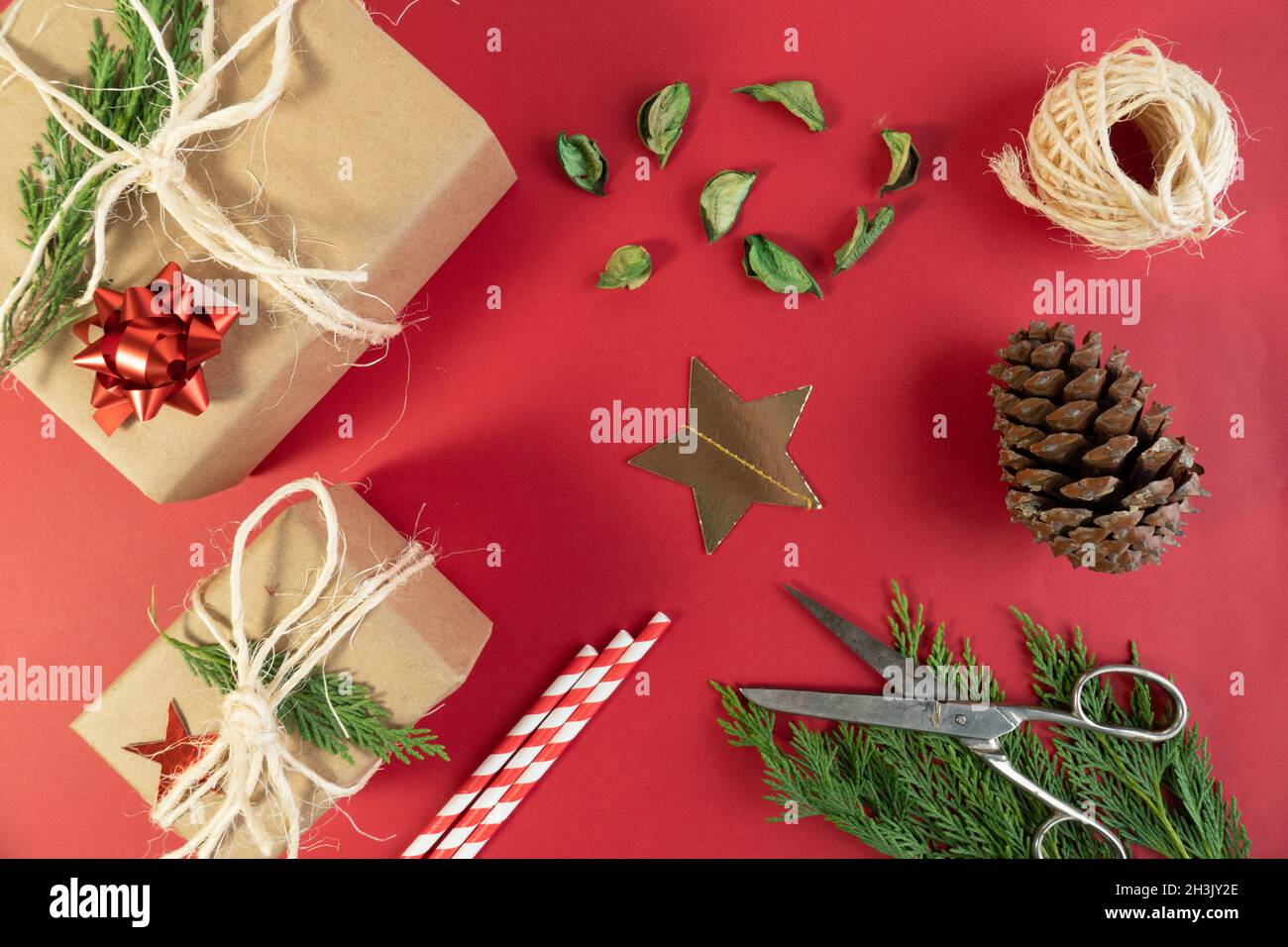 Christmas gift boxes, top view christmas concept idea photo with star icon, pine cone and leaf Stock Photo