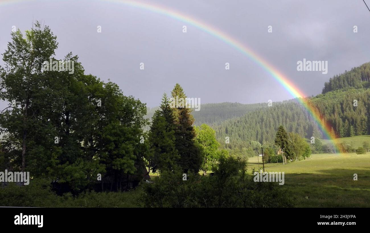 Evening mood with rainbow Stock Photo