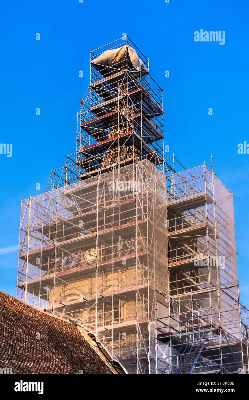 Scaffolding surrounding the steeple of the church of Notre-Dame in La Celle-Guenand, Indre-et-Loire (37), France. Stock Photo