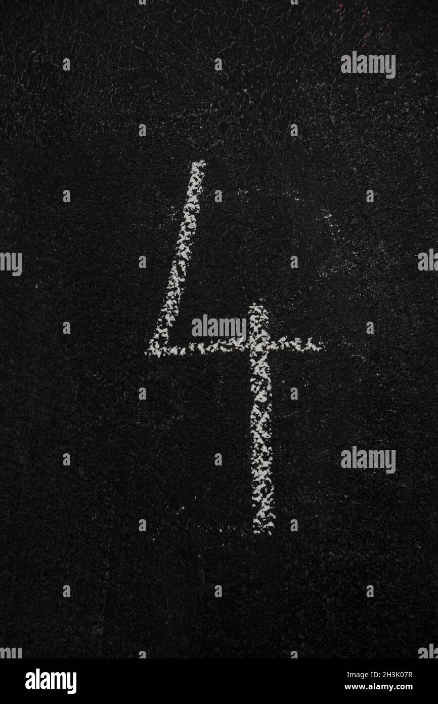 Number 4, four on black chalkboard Stock Photo