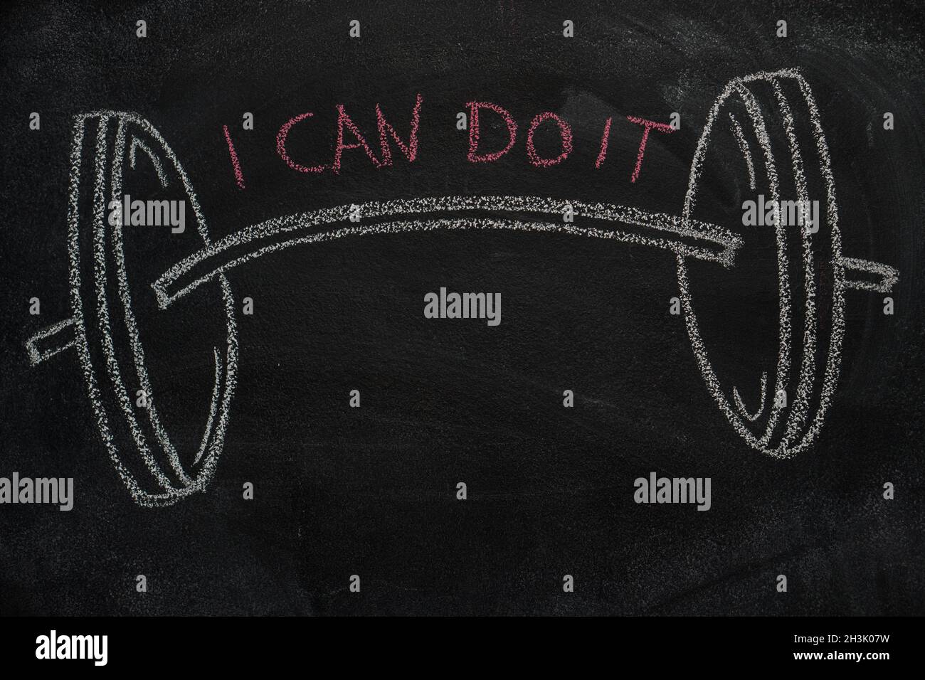Barbell and I can do it text on black chalkboard Stock Photo