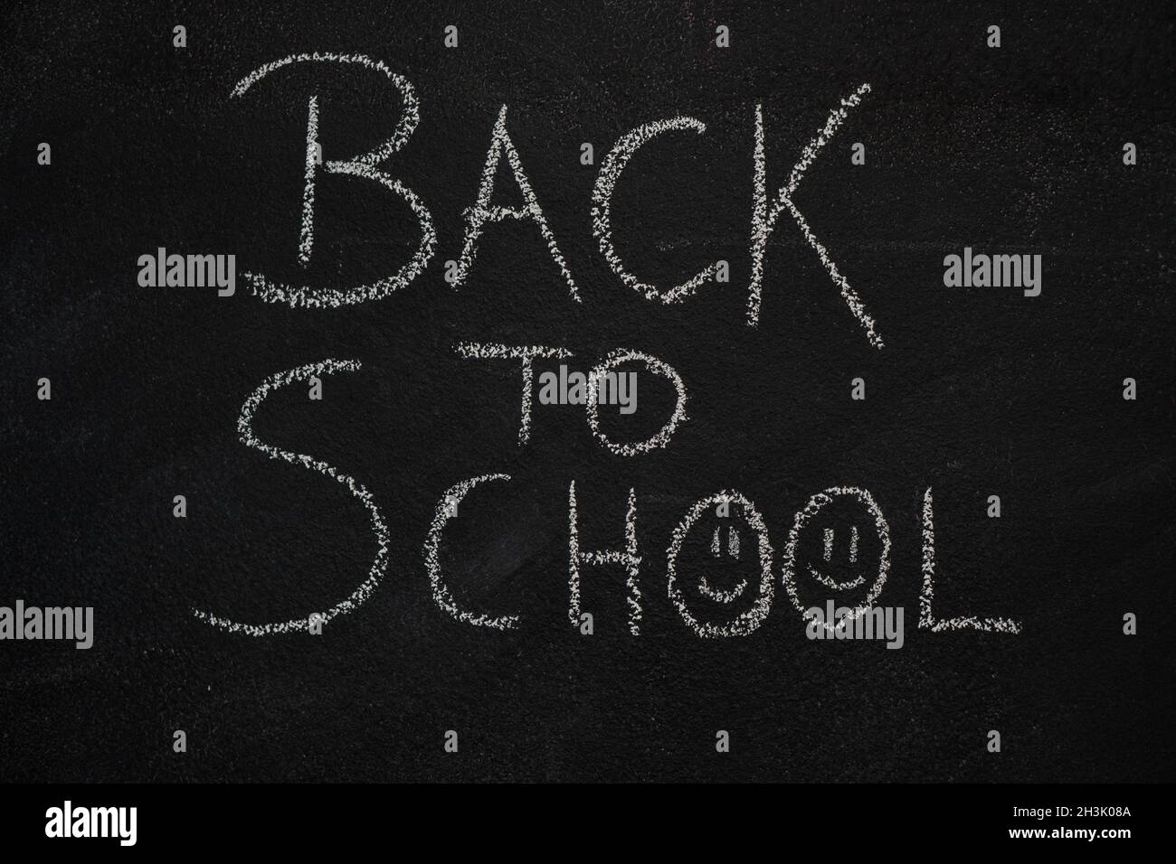 Back to school text on black chalkboard Stock Photo
