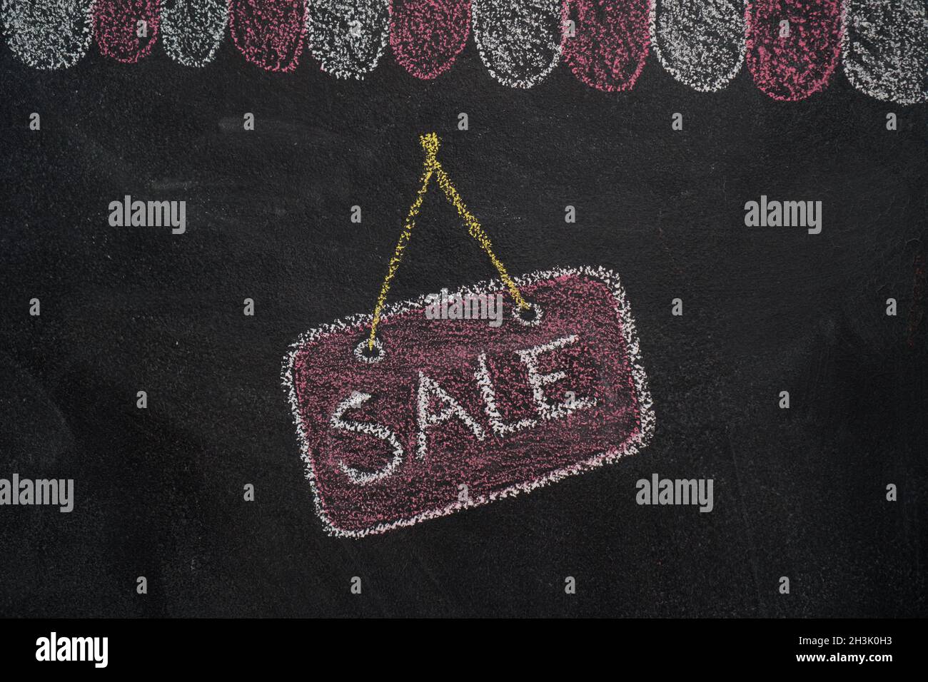 Shop cafe roof with sale sign on chalkboard Stock Photo