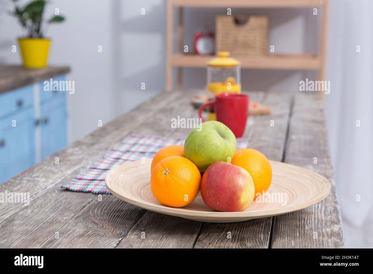 Close up view on fruit on a table at kitchens wooden table. Stock Photo