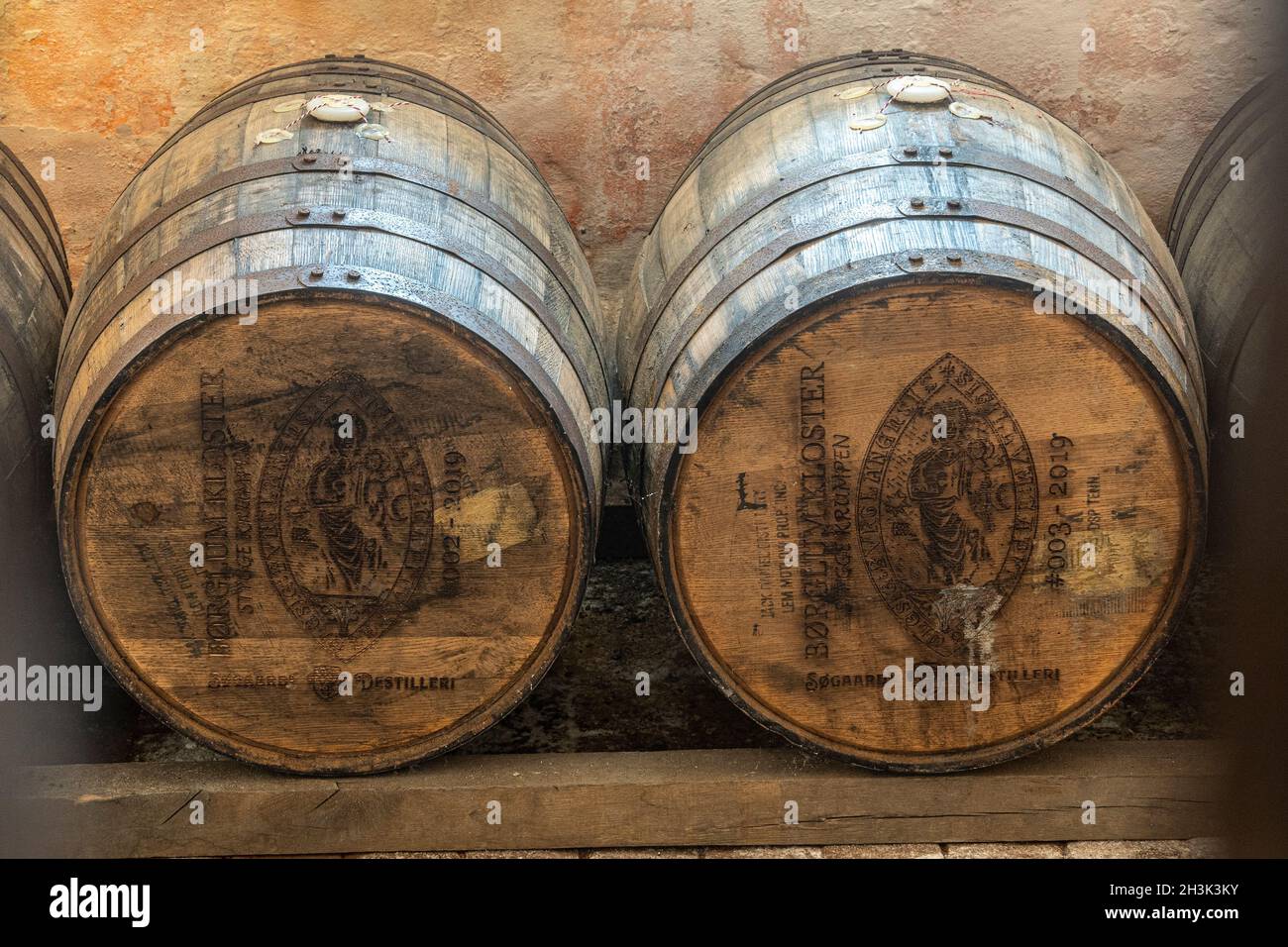 Antique beer barrels in the Børglum Abbey warehouse. Børglum Abbey, Hjørring, North Central Jutland, Denmark, Europe Stock Photo