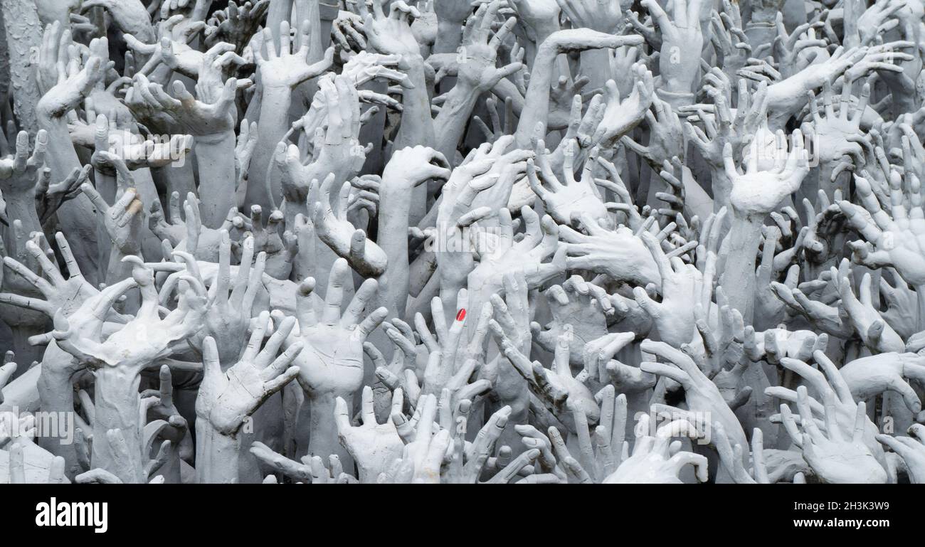 Hands in the Wat Rong Khun Temple  Chiang Rai Stock Photo