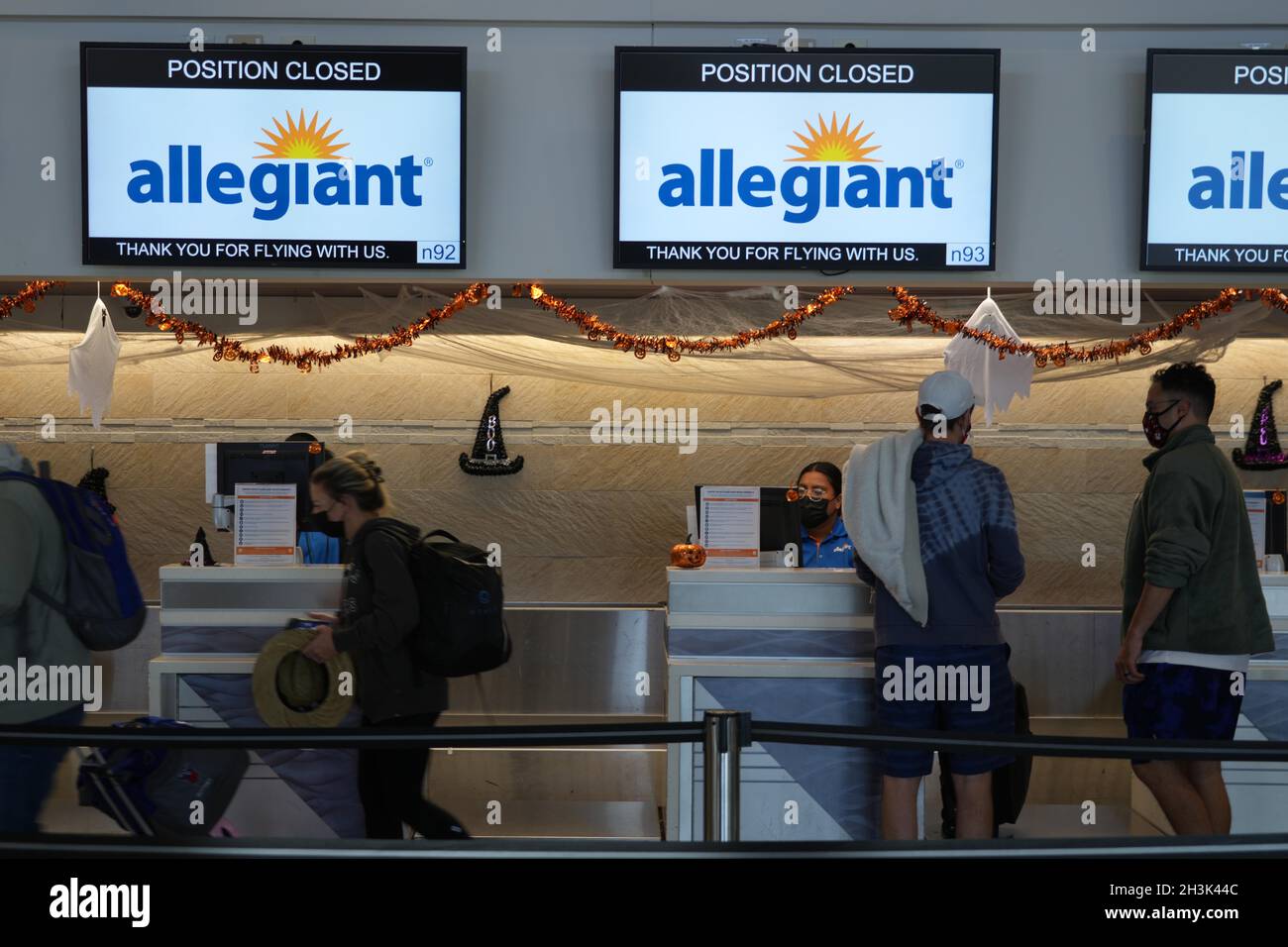 Passengers at an Allegiant Airlines ticket counter at the McCarran