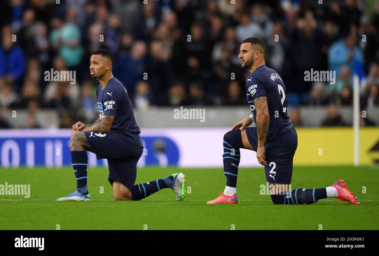 Manchester City's Kyle Walker and Gabriel Jesus take the knee before the match at the Amex Stadium, Brighton. Stock Photo