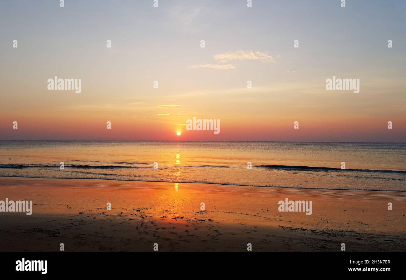 Beautiful sunset and the beach Stock Photo - Alamy