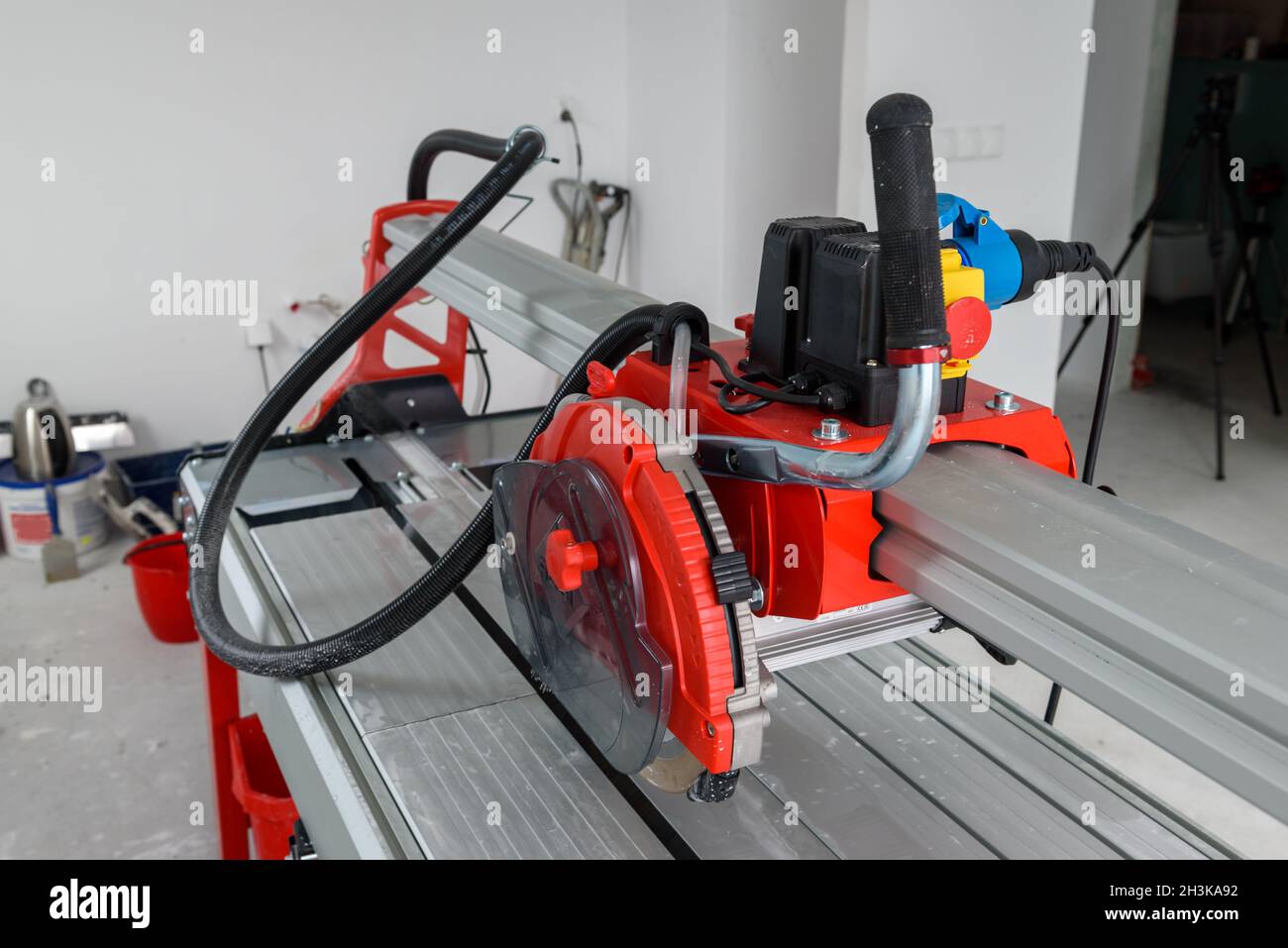Cutter machine for ceramic tiles. A flat during renovation. Stock Photo