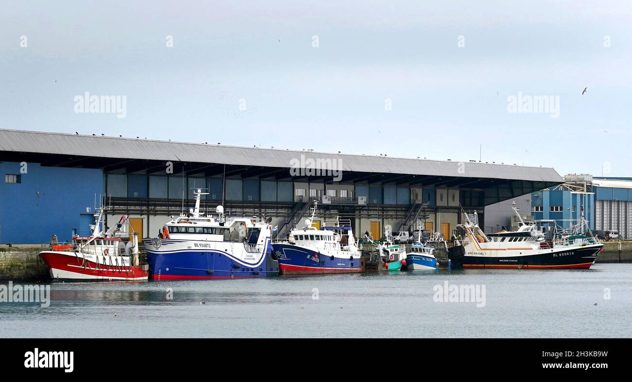 Fishing boats moored in the port of Boulogne, France. Environment Secretary George Eustice has warned France the UK could retaliate if it goes ahead with threats in the fishing row, warning that 'two can play at that game'. Picture date: Friday October 29, 2021. Stock Photo