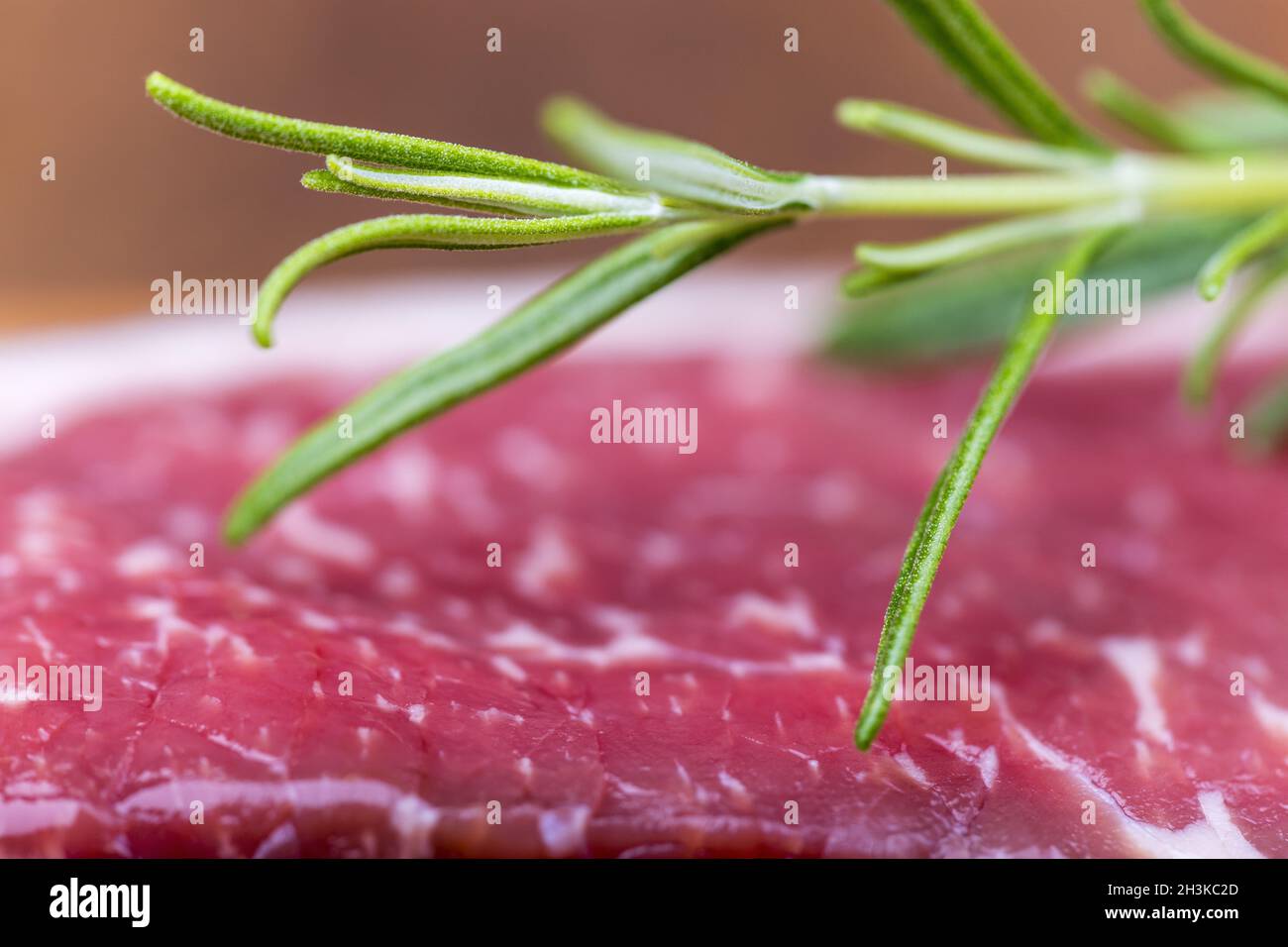 Raw steak on olive wood Stock Photo Alamy