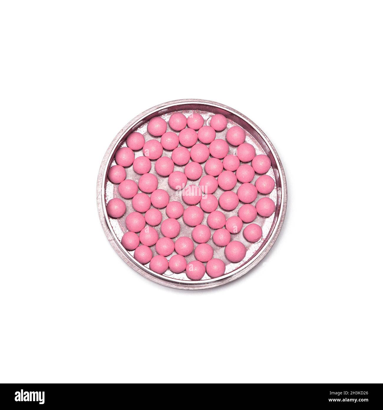 Jar of pink ball blusher isolated on white background, close-up Stock Photo