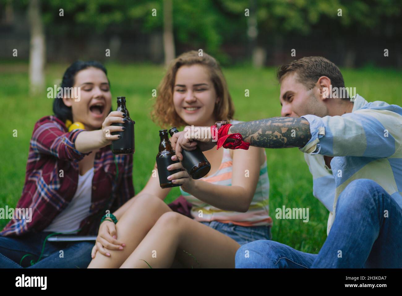 Having a drink in a park Stock Photo