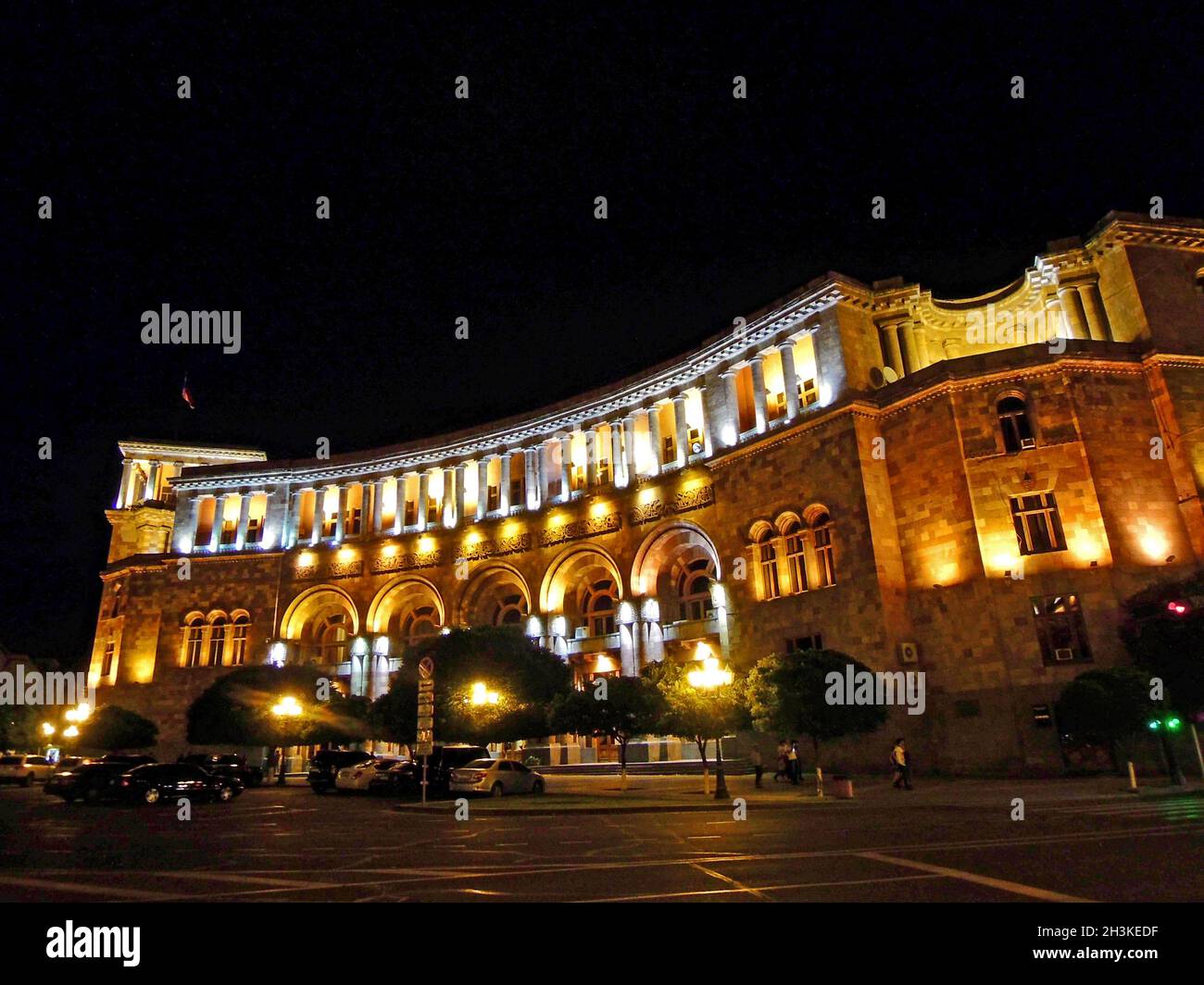 Building of the Government House at night and the central streets of Yerevan, Armenia Stock Photo