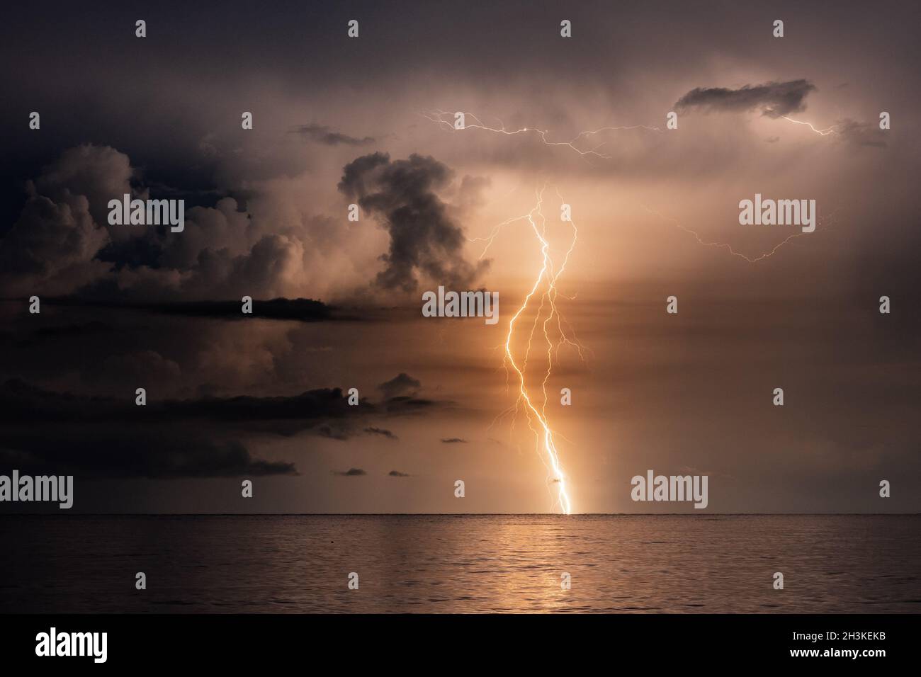 Beautiful scenery of the lightning over a lake at sunset, Miramar Beach, Florida Stock Photo
