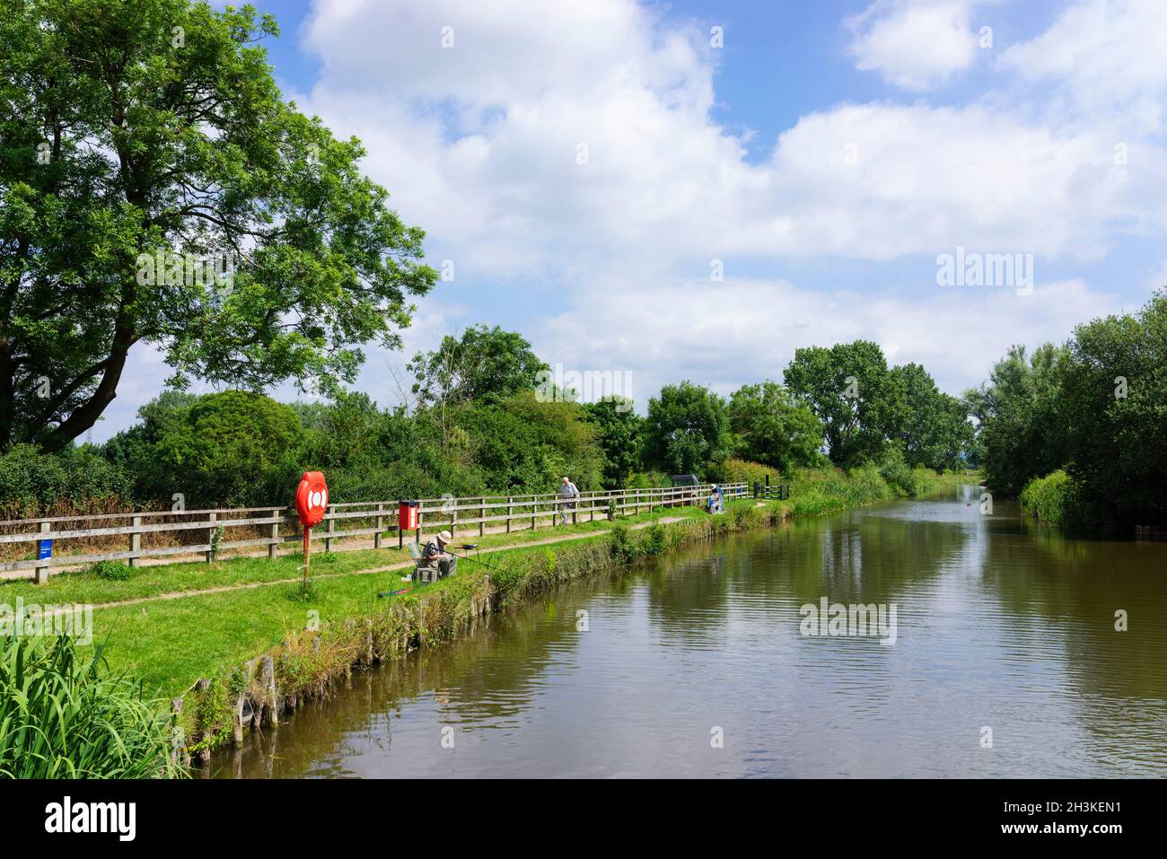 Fisherman fishing at Hickling Basin on the Grantham Canal Leicestershire England UK GB Europe Stock Photo