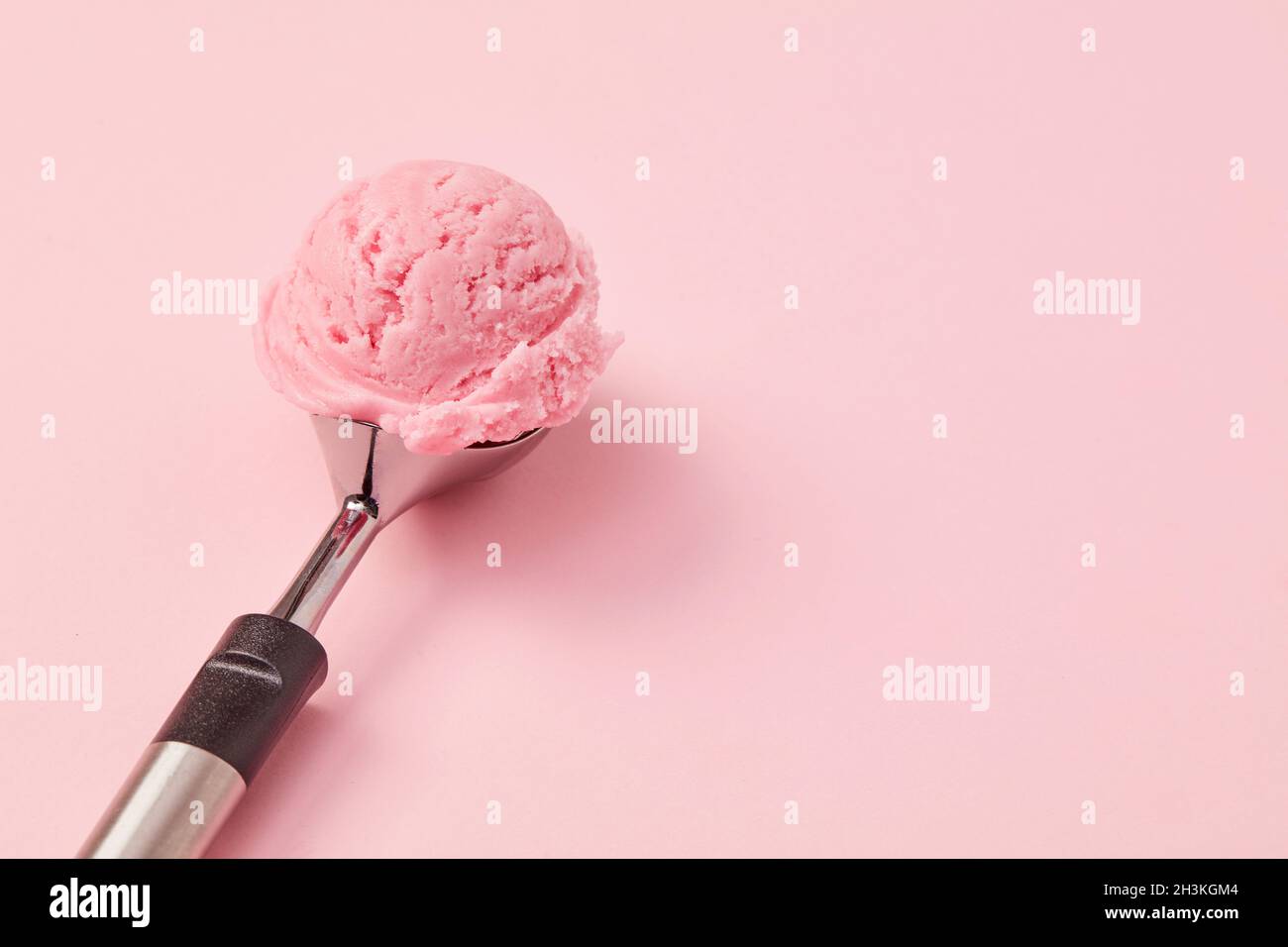 Ice cream scoop on pink background Stock Photo - Alamy