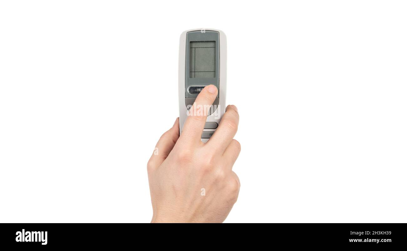 hand pressing button on remote control isolated on white, controlling Stock Photo