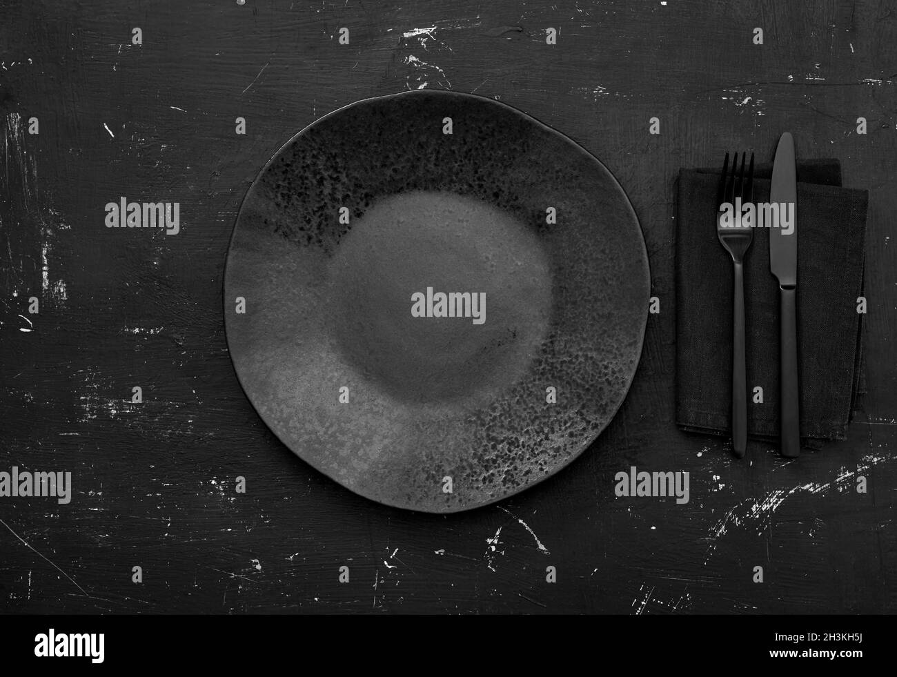 Black empty plate on table Stock Photo