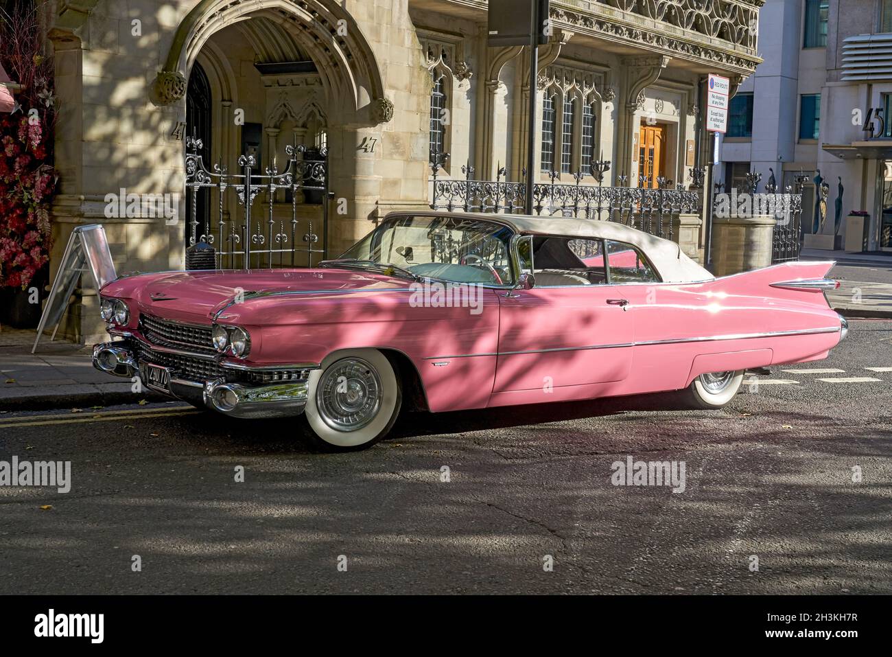 Pink cadillac.   Exocit car.  Park Lane.  Pink car.  Colour pink Stock Photo