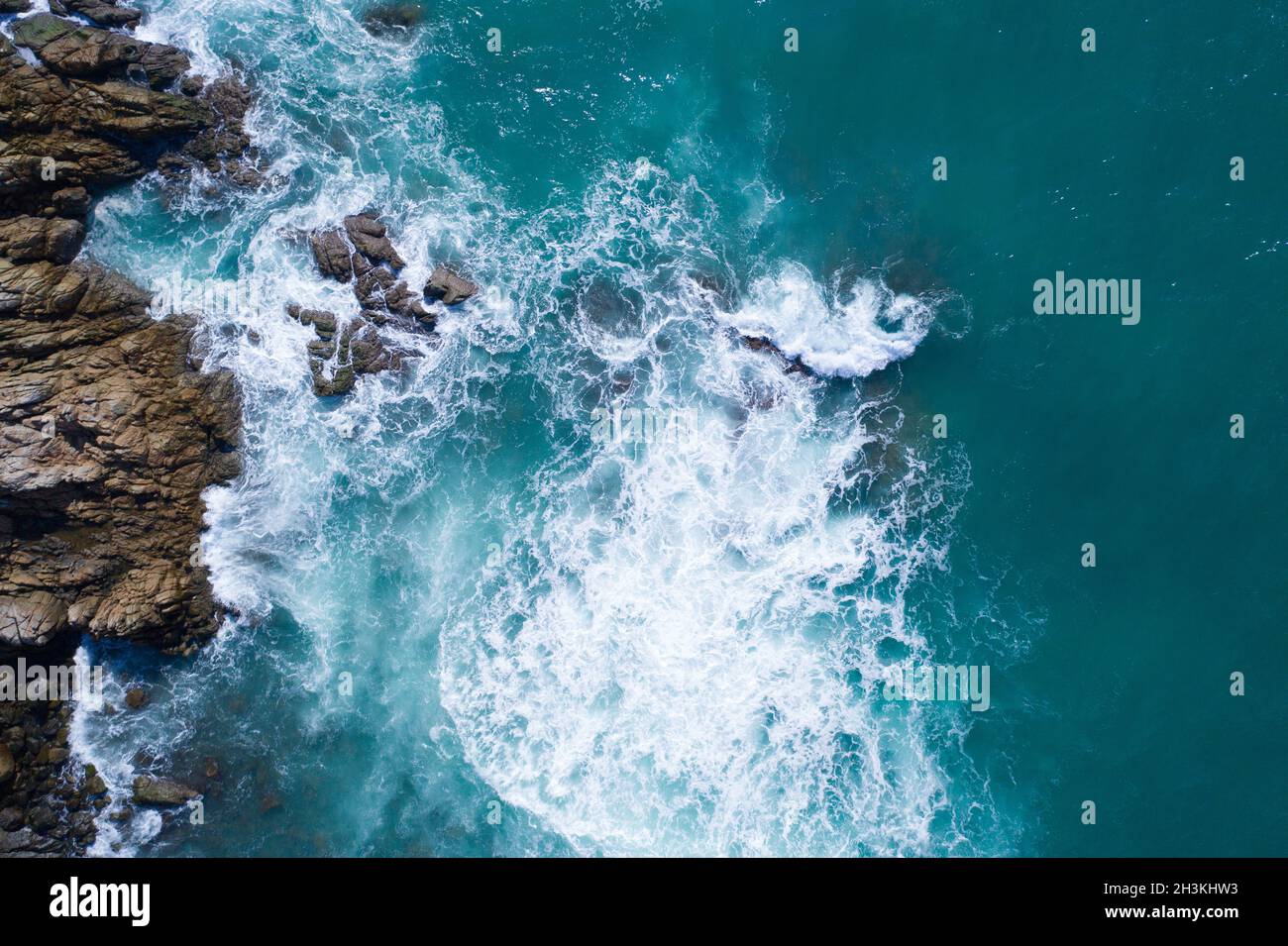 Aerial view of ocean's beautiful waves and rocky coast Stock Photo - Alamy