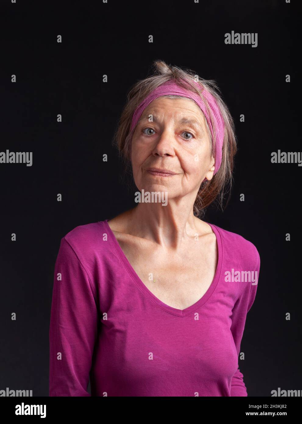Happy smiling in her seventy-five year old lady Stock Photo