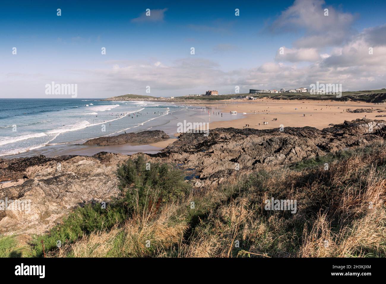 Rocks in the littoral aone exposed by a low tide at Fistral Beach in Newquay in Cornwall. Stock Photo