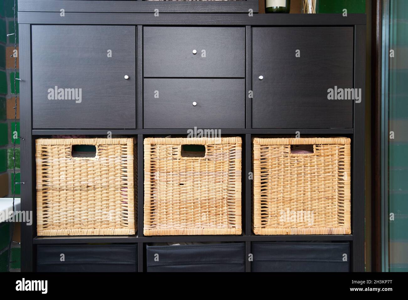 Wicker boxes for things on the shelves. Wardrobe for storage of things Stock Photo Alamy