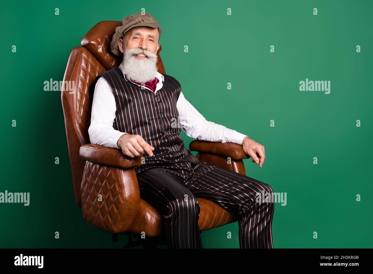 Photo of cheerful grandpa sit comfortable armchair enjoy rest wear