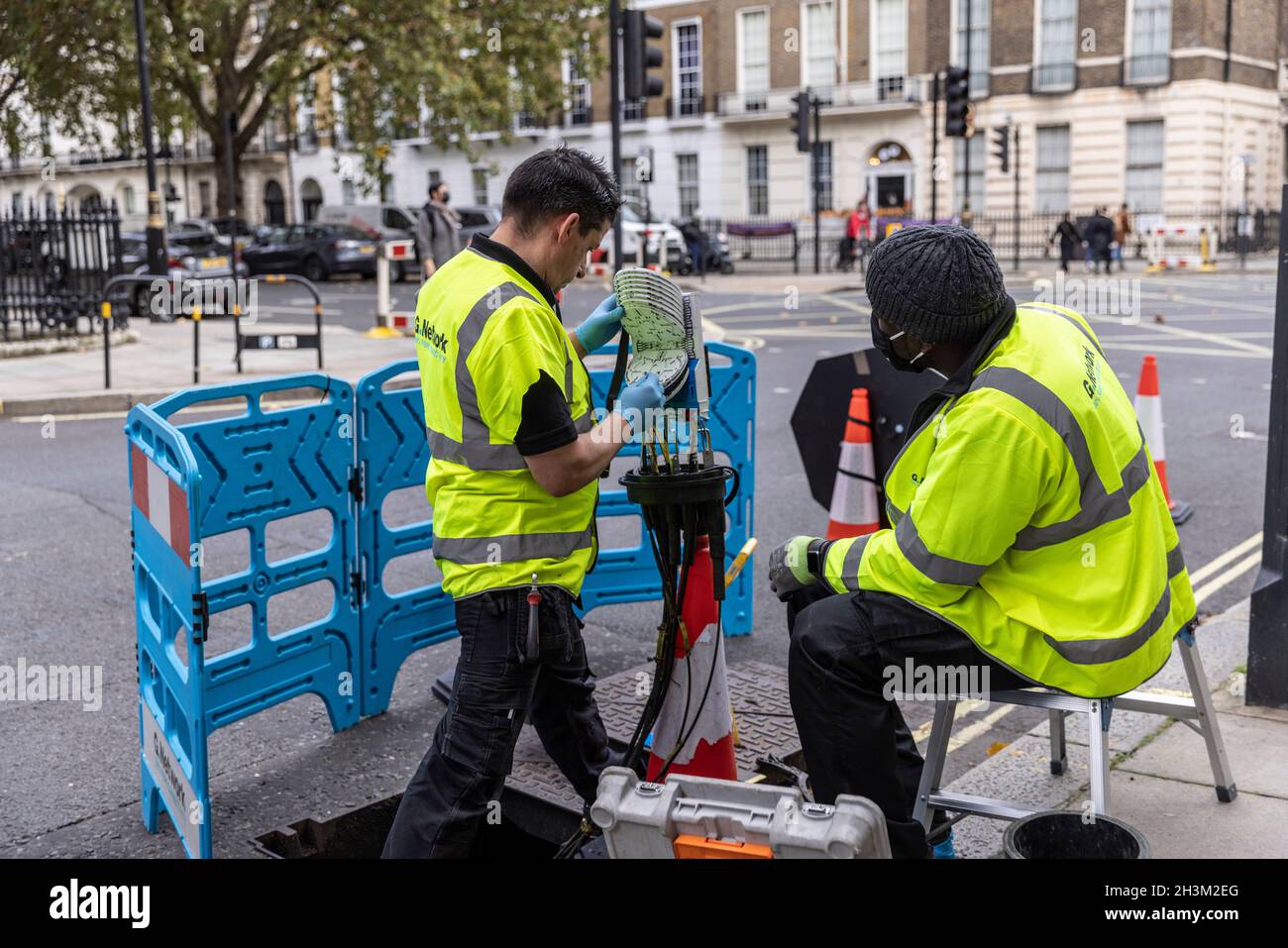 engineers connecting fibre broadband network