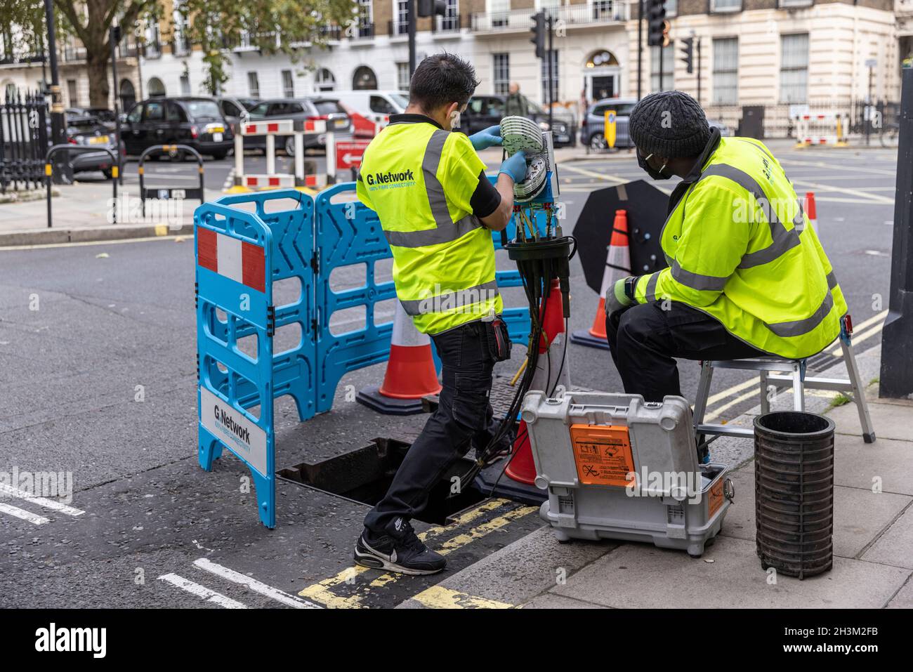 engineers connecting fibre broadband network