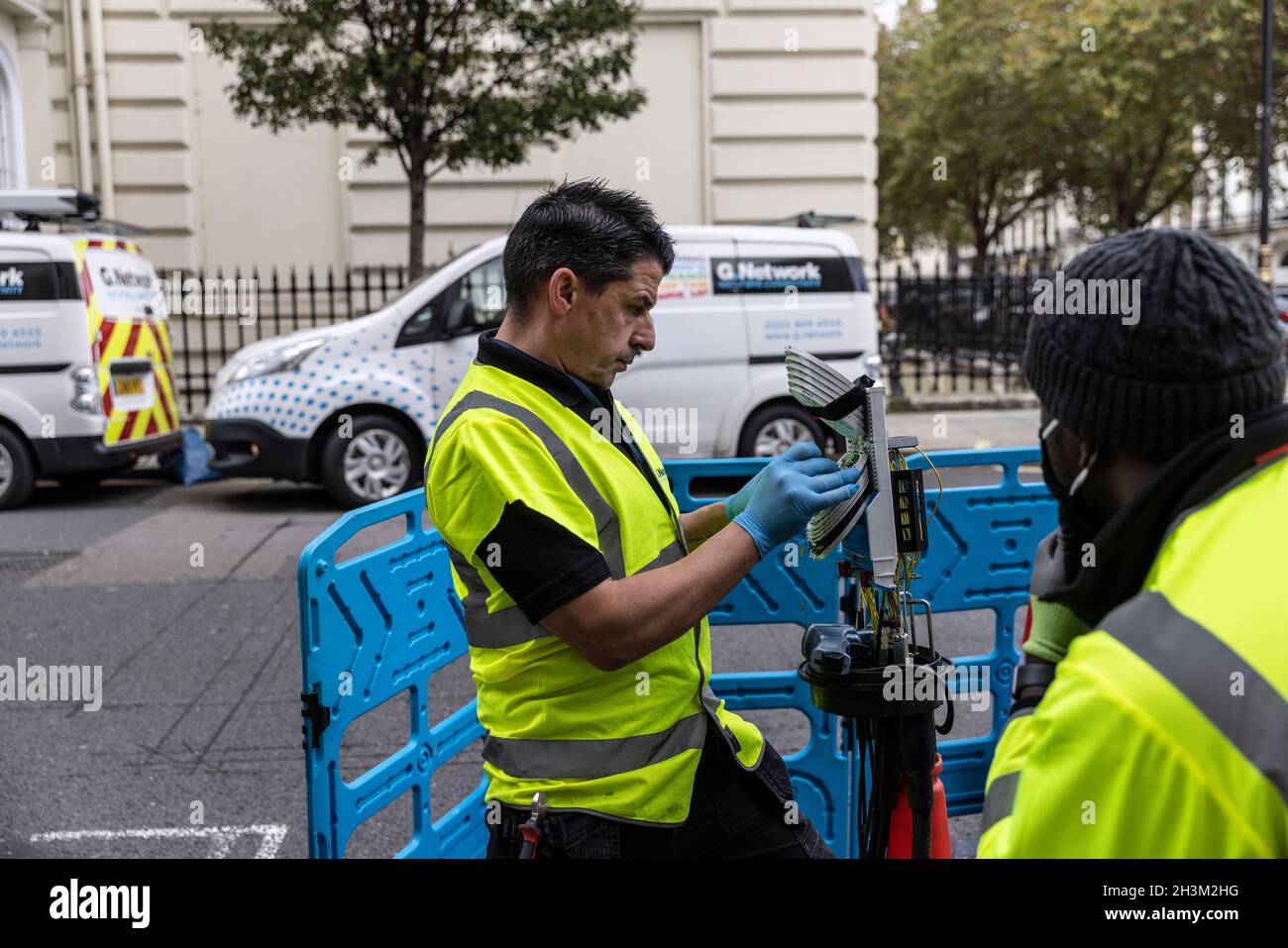 engineers connecting fibre broadband network