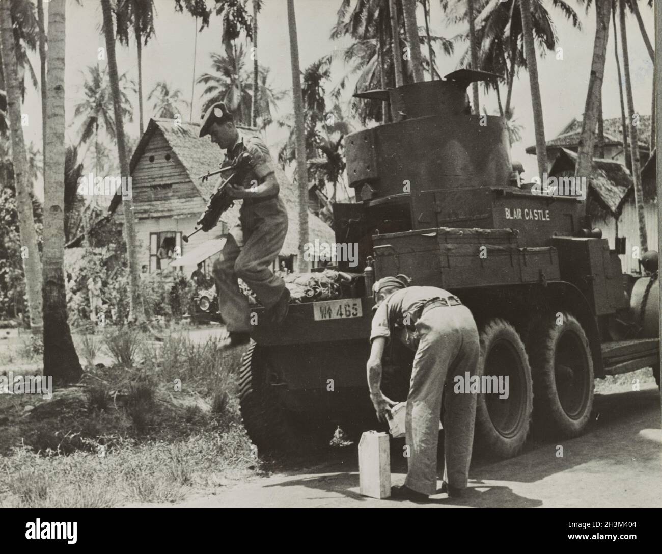 A vintage photo circa 1942 showing soldiers of the 2nd battalion of Argyll & Sutherland Highlanders British Army in the jungle next to a Lanchester 6x4 armoured car during the Japanese invasion of Malaya and the fall of Singapore Stock Photo