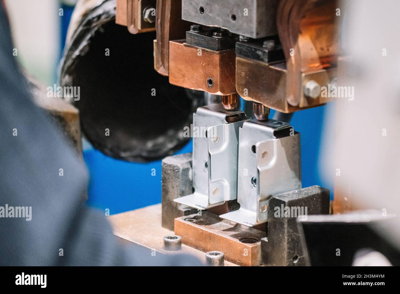 Spot welding machine Industrial automotive part in factory. Operator