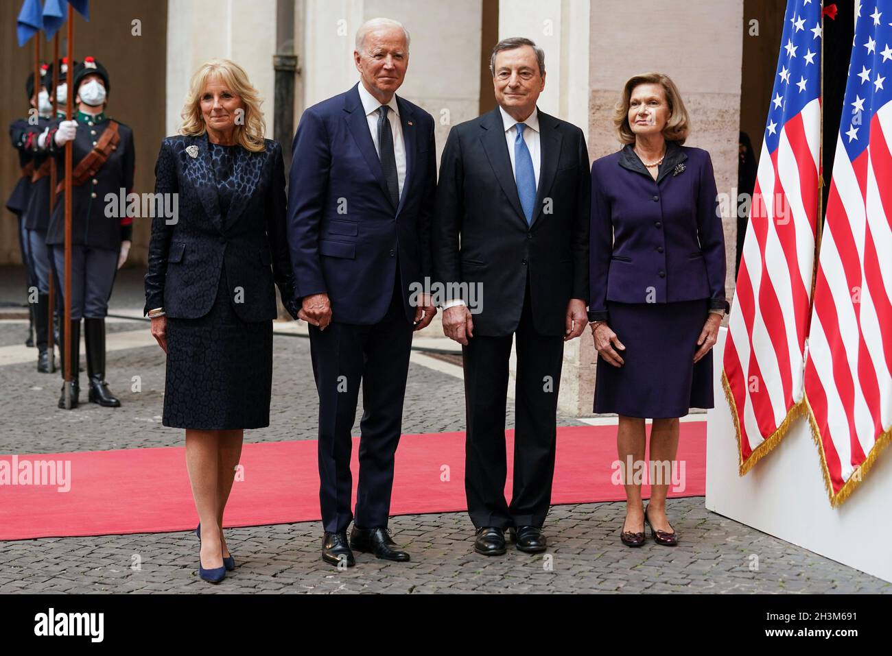 U.S. President Joe Biden and his wife Jill Biden stand next to Italian  Prime Minister Mario Draghi and his wife Maria Serenella Cappello as they  meet ahead of the G20 summit, in
