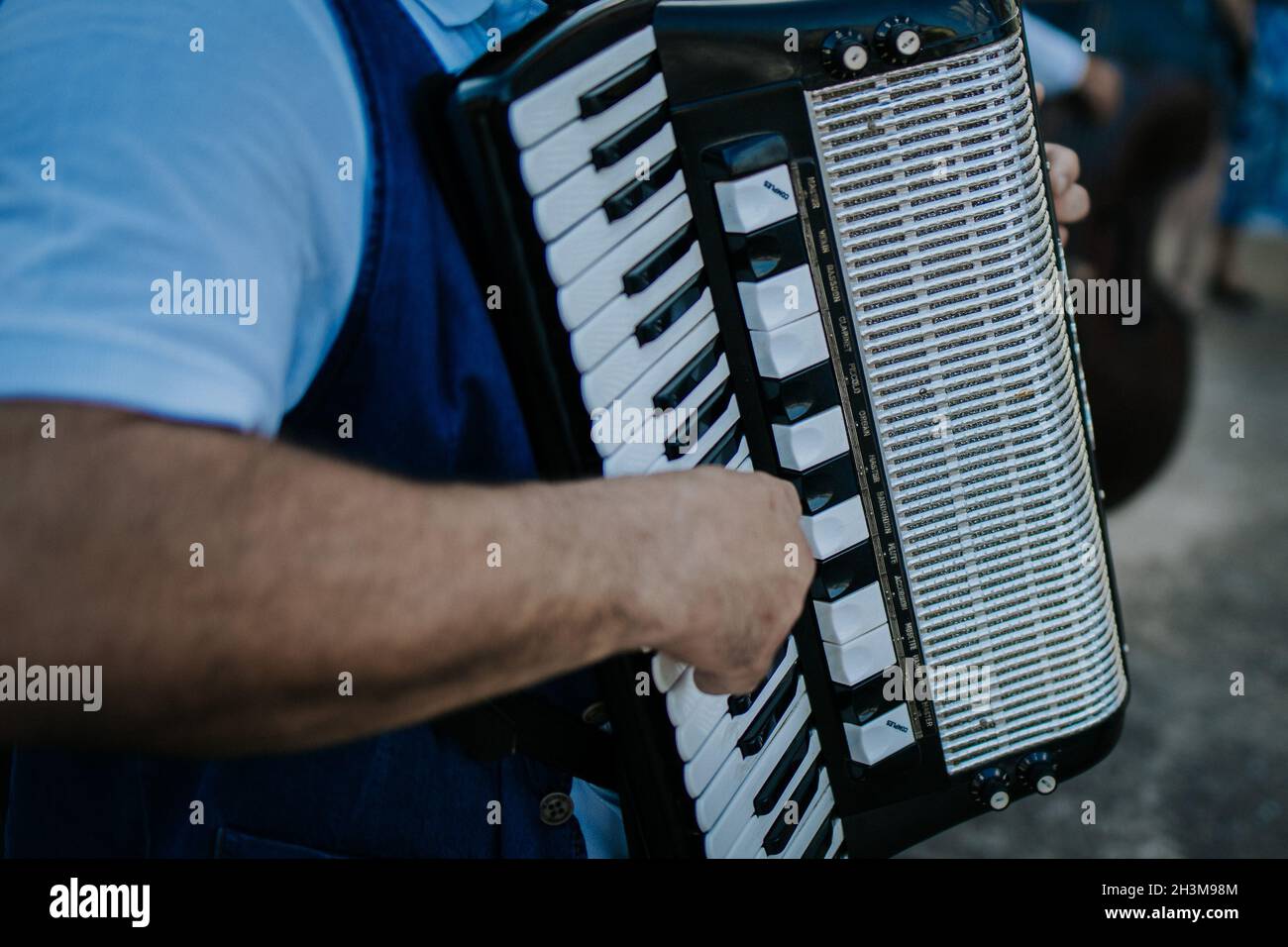Closeup shot of a man playing accordion outdoors Stock Photo