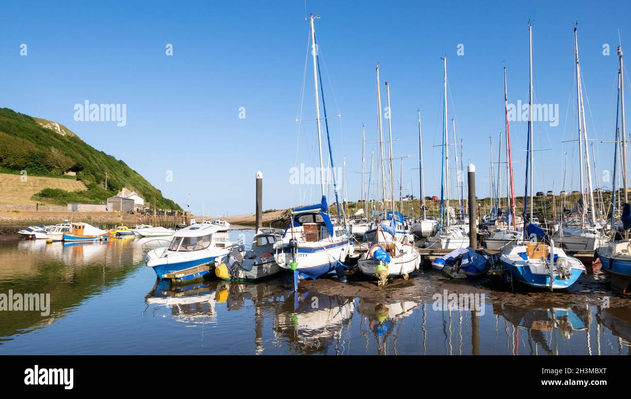 Yachts in Axe Yacht club in Axmouth harbour on the River Axe at Haven Cliffs Seaton Devon England UK GB Europe Stock Photo
