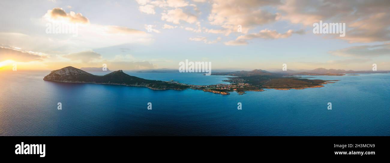 View from above, aerial shot, stunning panoramic view of Golfo Aranci during a beautiful sunrise. Stock Photo