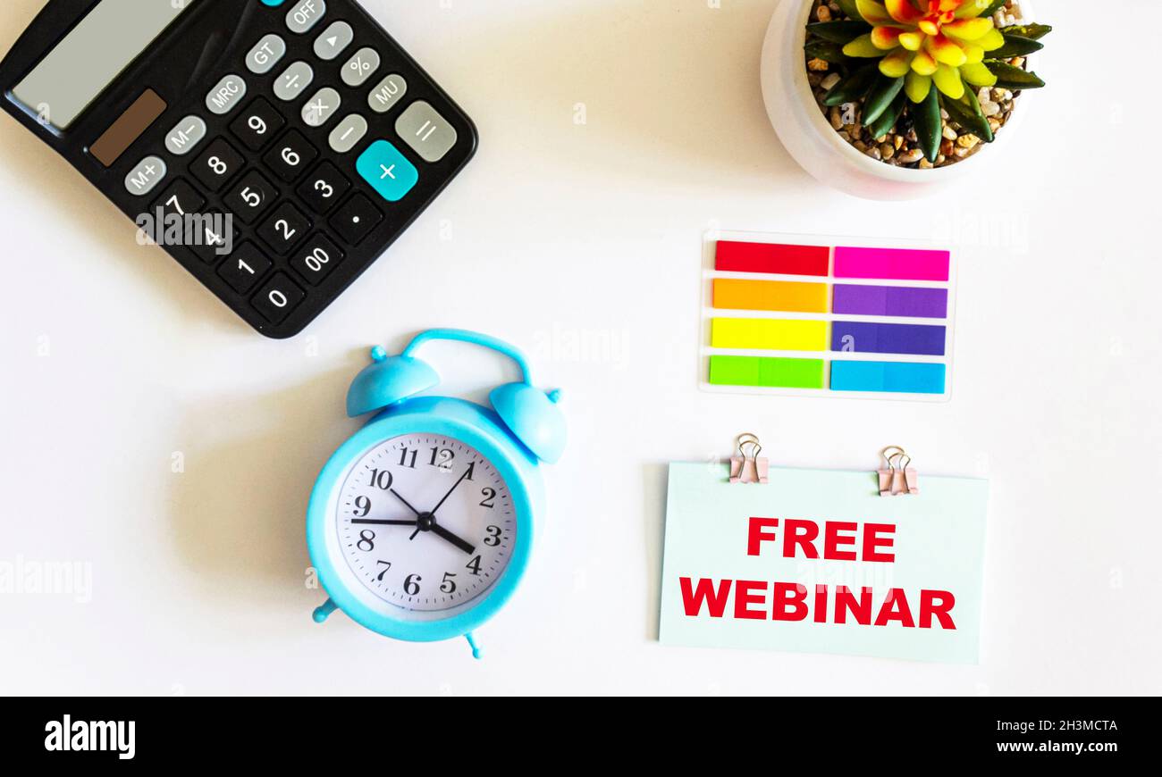 Free webinar is written on a sticker and a white background. Stock Photo