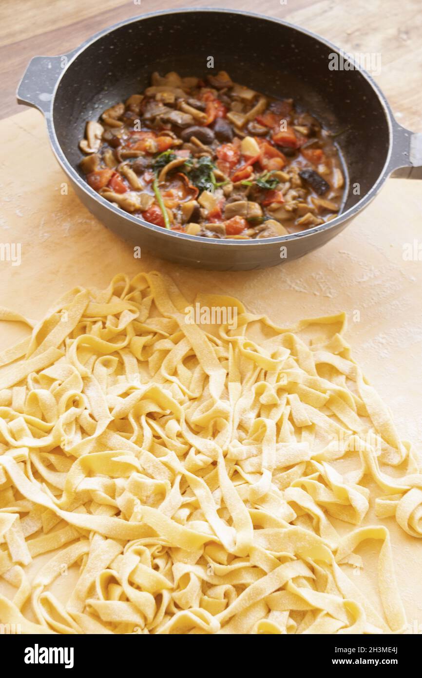 handmade tagliatelle with sauce at the mushrooms made in pan Stock