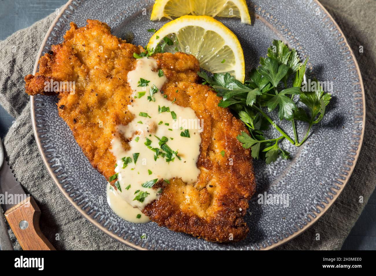 Homemade German Chicken Schnitzel with Lemon and Sauce Stock Photo Alamy